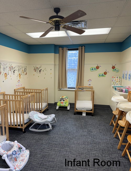 Infant room with mobiles and play mats