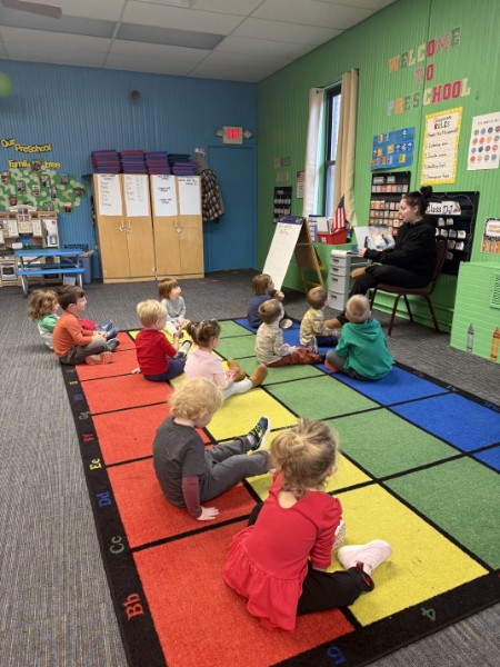 Ms. Jenna reading to the class